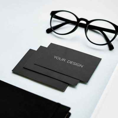 closeup-of-black-paper-cards-with-eyeglasses-on-ta-2025-02-10-05-59-27-utc_11zon-scaled.jpg